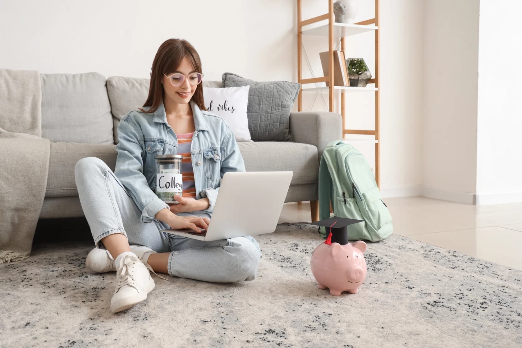 university-student-studying-financial-aid-options-with-grants-loans-documentation-and-calculator